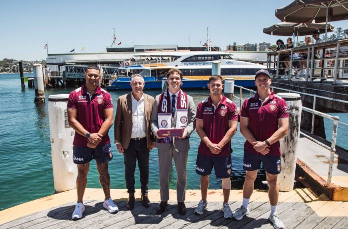 Manly Fast Ferry (1)22 Manly Warringah Sea Eagles players stand with MFF staff at Manly Wharf